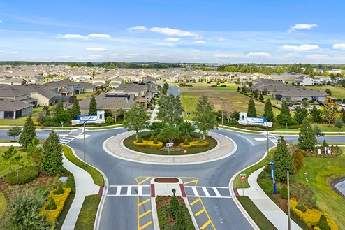 Entrance to neighborhood in a round about.