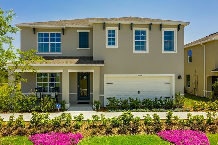 two-story new home with siding, covered porch and 2 car garage.