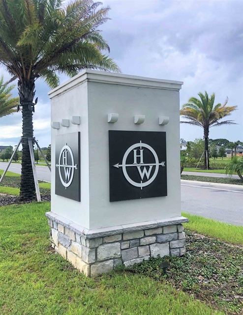 Harmony West logo on monument.