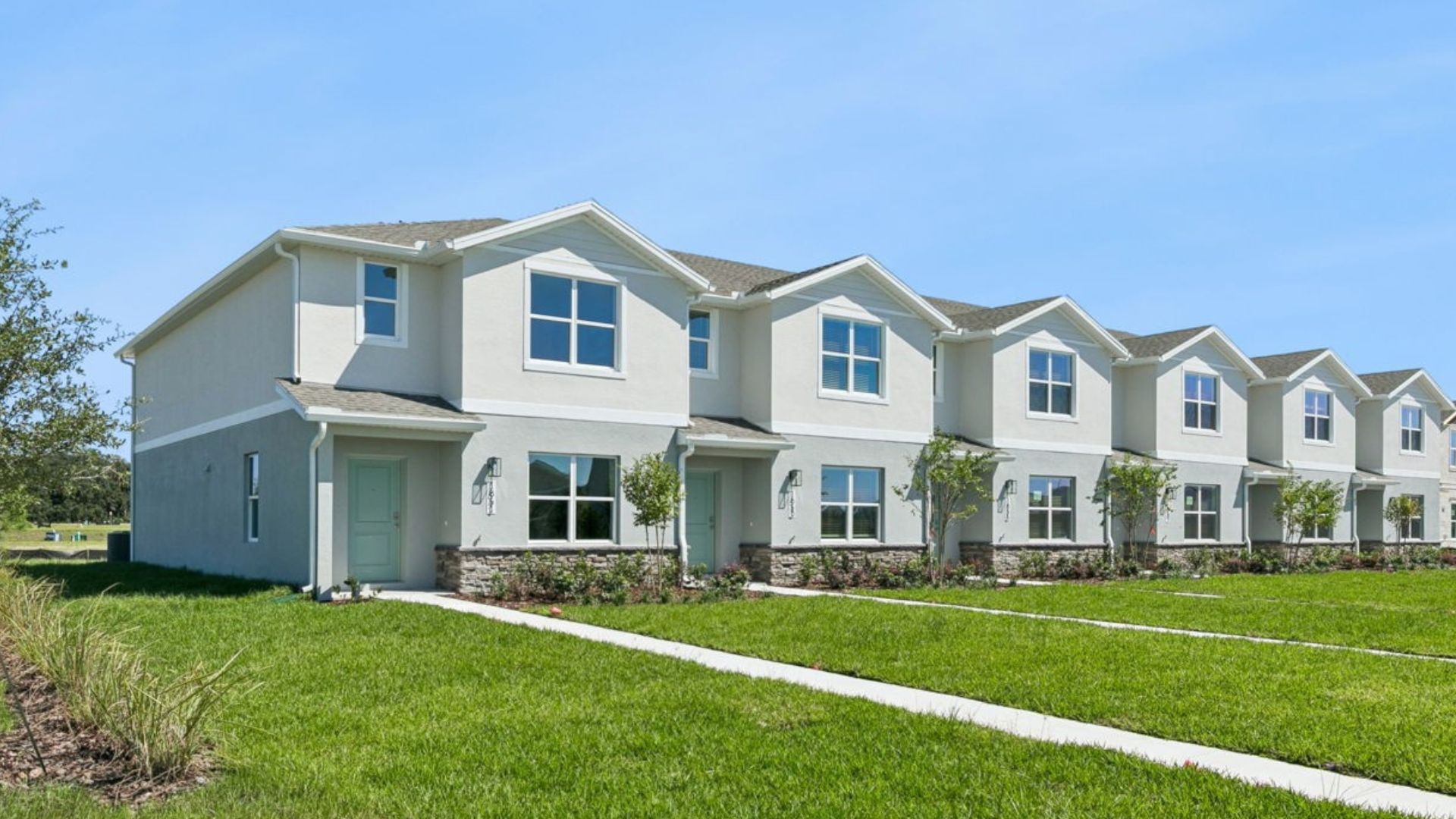 Attached townhome with concrete block construction and a one-car garage.