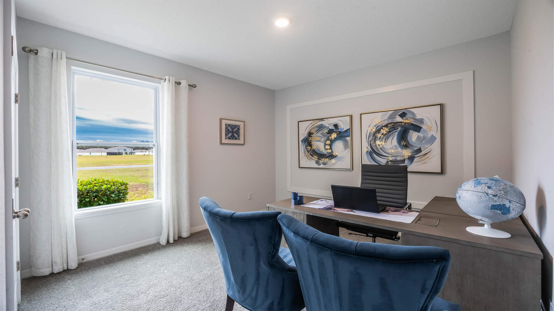 Functional home office with desk, chairs and space to work or play.