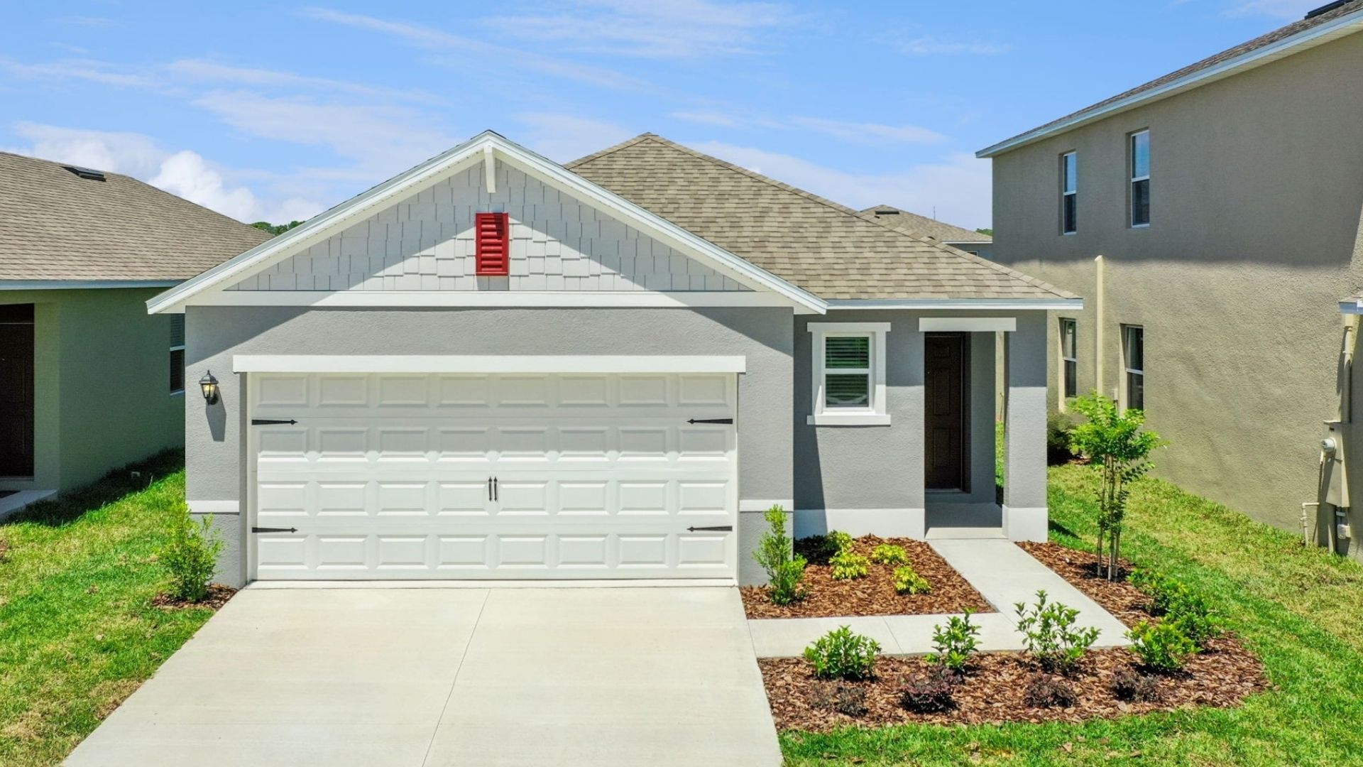 Single story new home covered porch and 2 car garage.