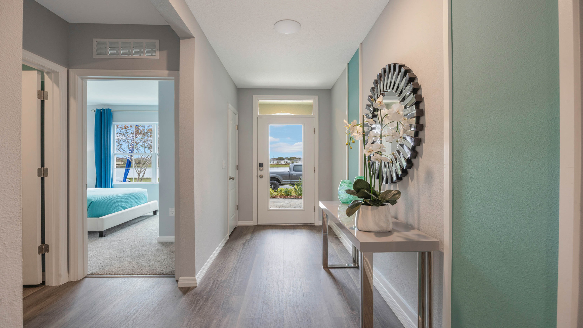 Home entry way through the front door with Luxury vinyl plank flooring.
