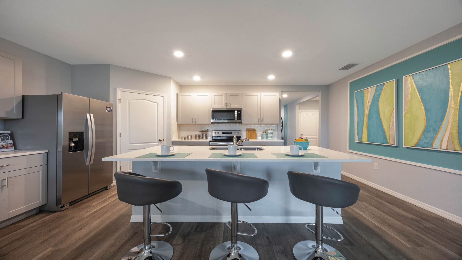 Kitchen with tall cabinetry, appliances, walk in pantry and Luxury vinyl plank flooring.Kitchen with tall cabinetry, appliances, walk in pantry and Luxury vinyl plank flooring.