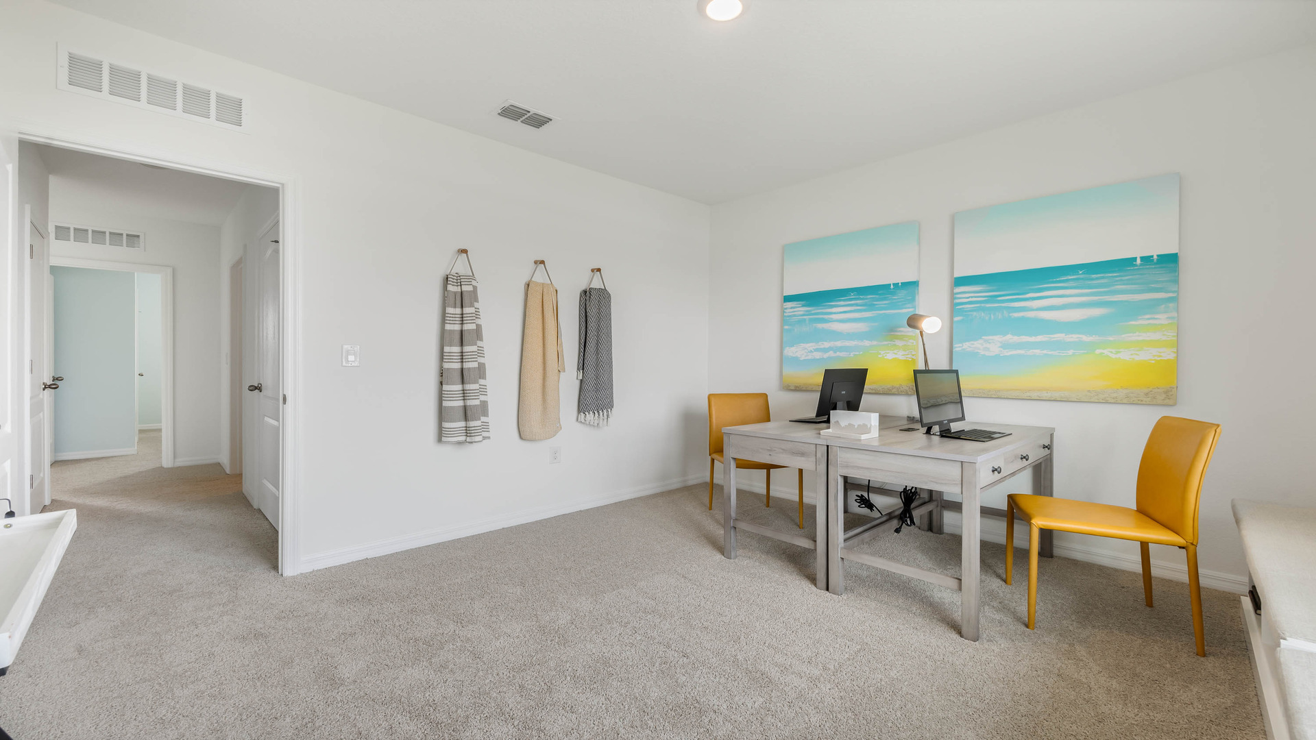 Guest bedroom with bed, nighstands and natural lighting.