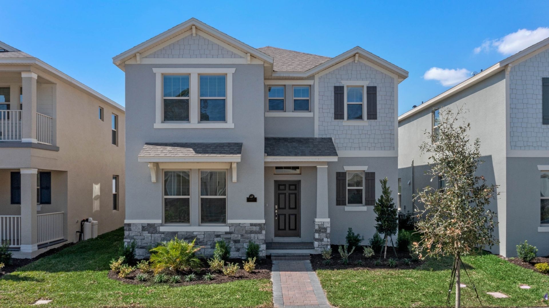 two story home with two car garage