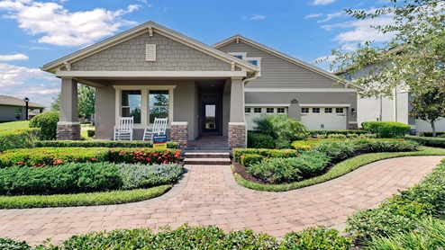 One-story home with two car garage and porch,