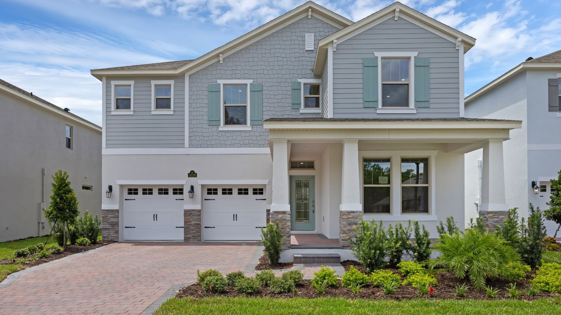 two story home with two car garage
