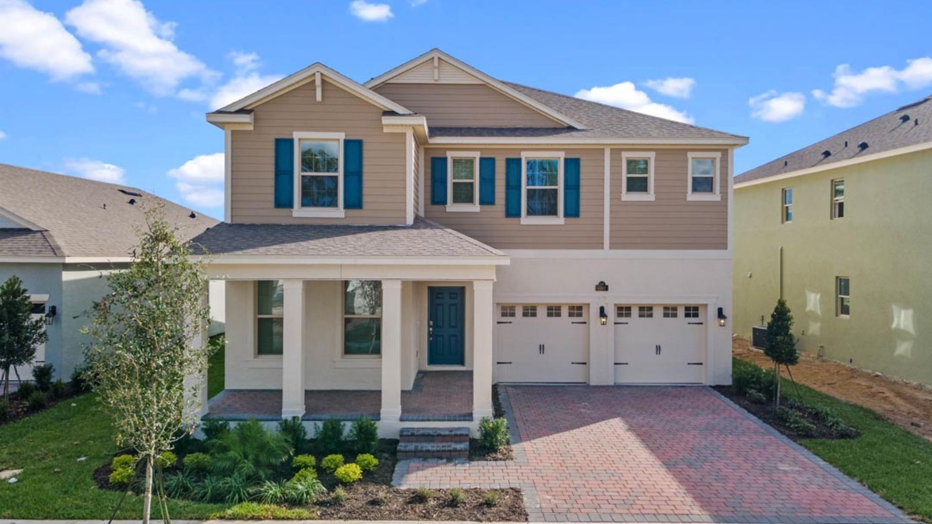 Two-story home with two car garage.