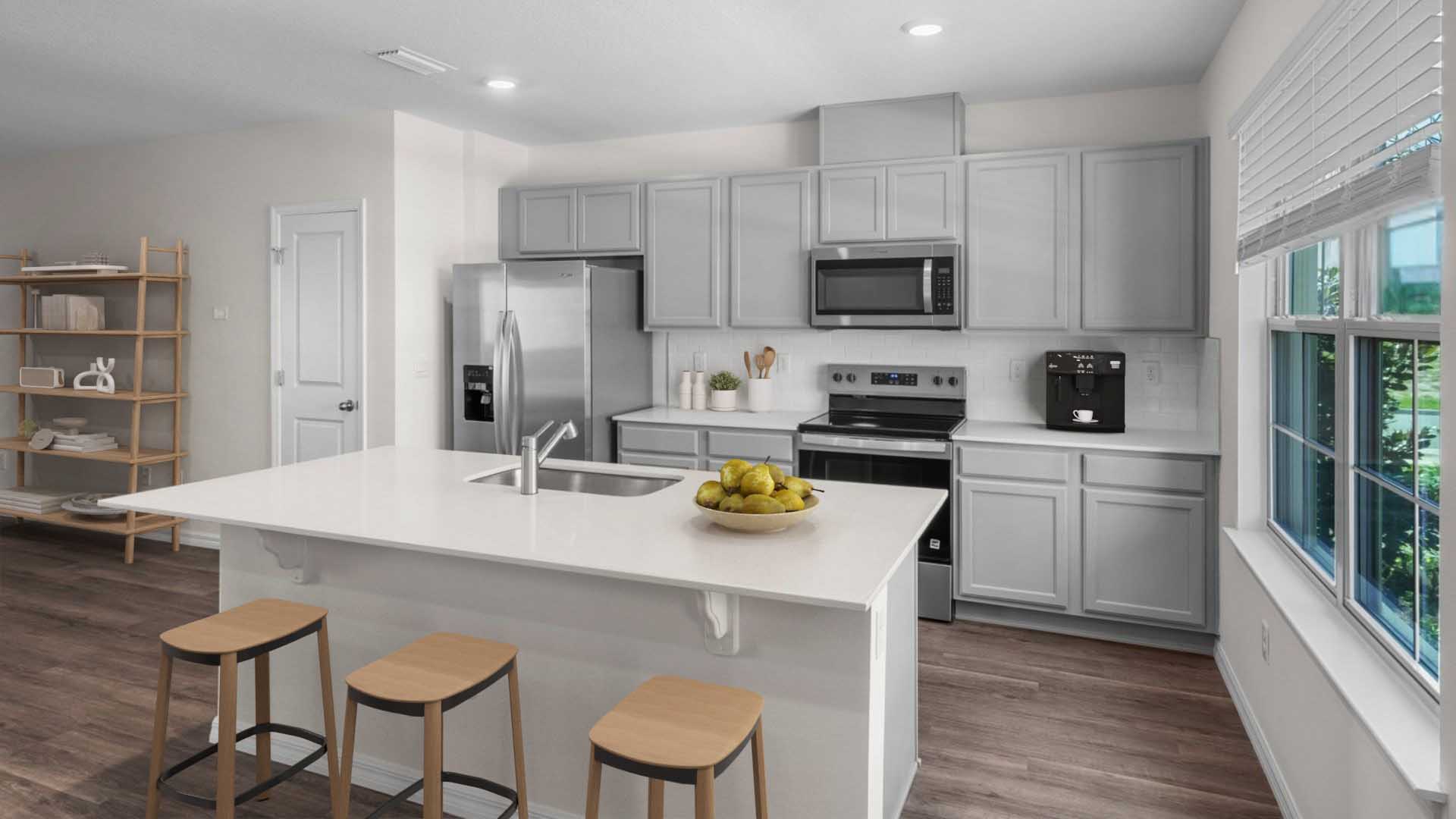 Kitchen with island seating, quartz counters, spacious pantry and stainless steel appliances
