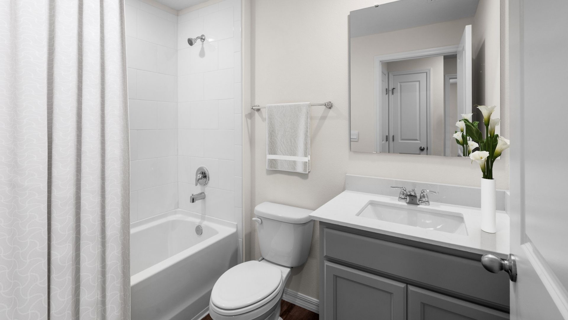 bathroom with single vanity quartz counters, toilet and shower