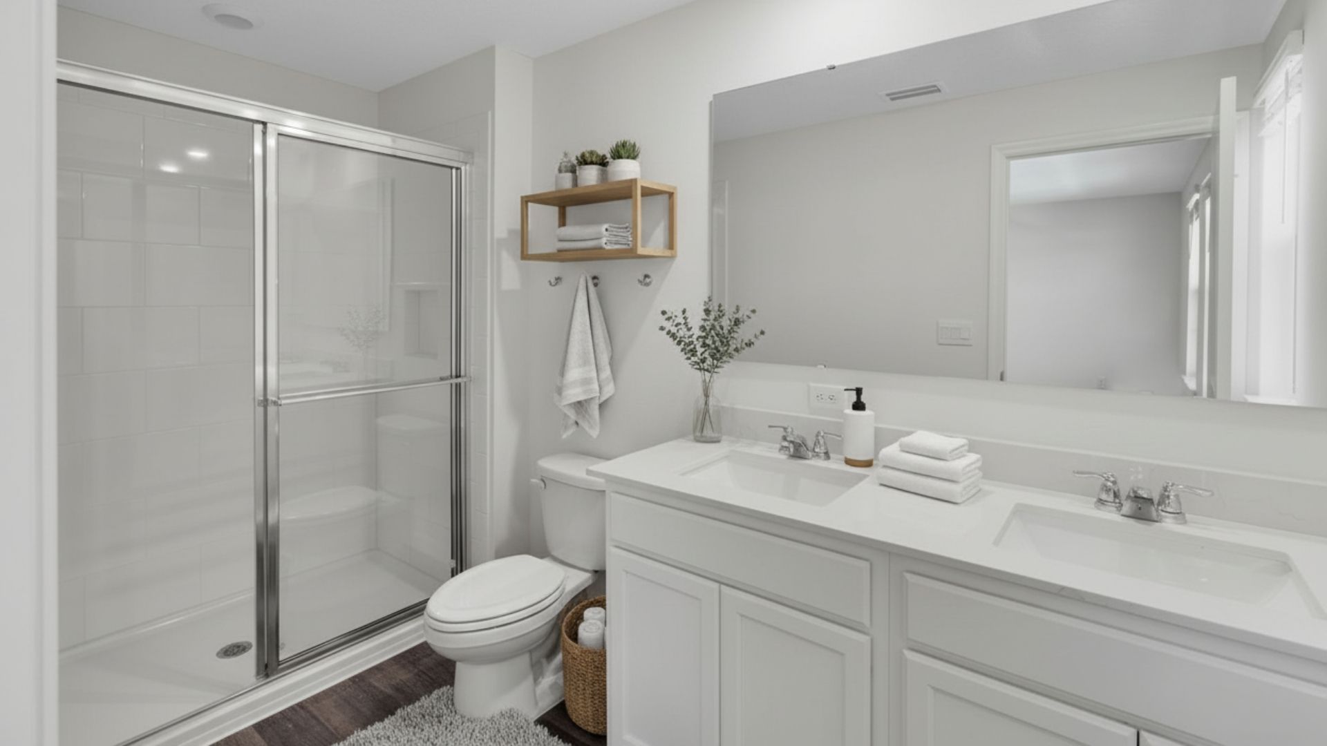 primary bathroom with quartz counters double sink and revwood select flooring