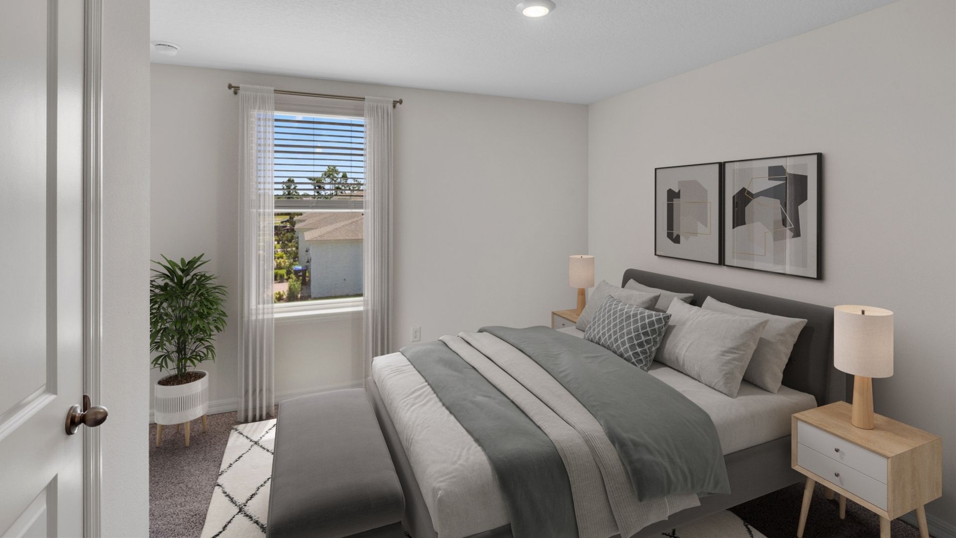 guest bedroom with queen bed and carpet flooring