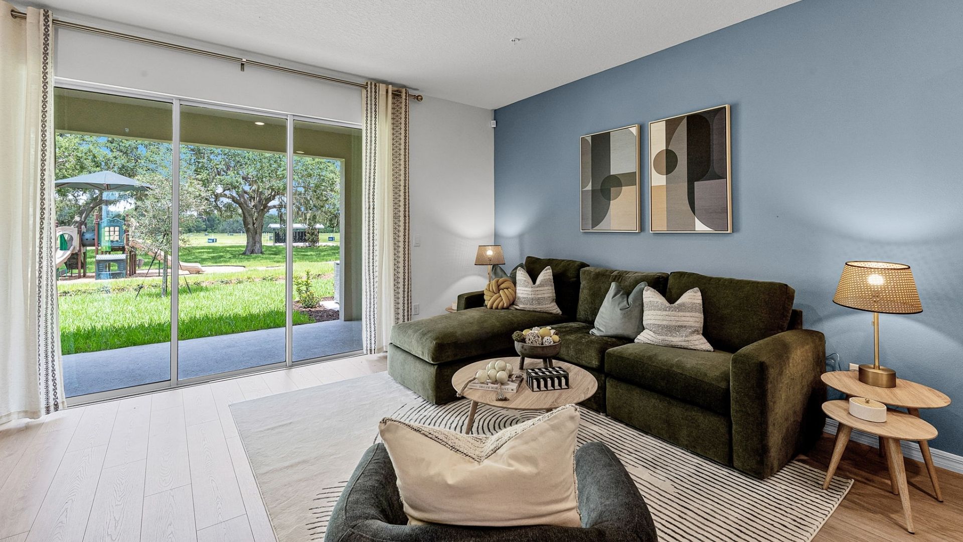 living area with seating and revwood flooring