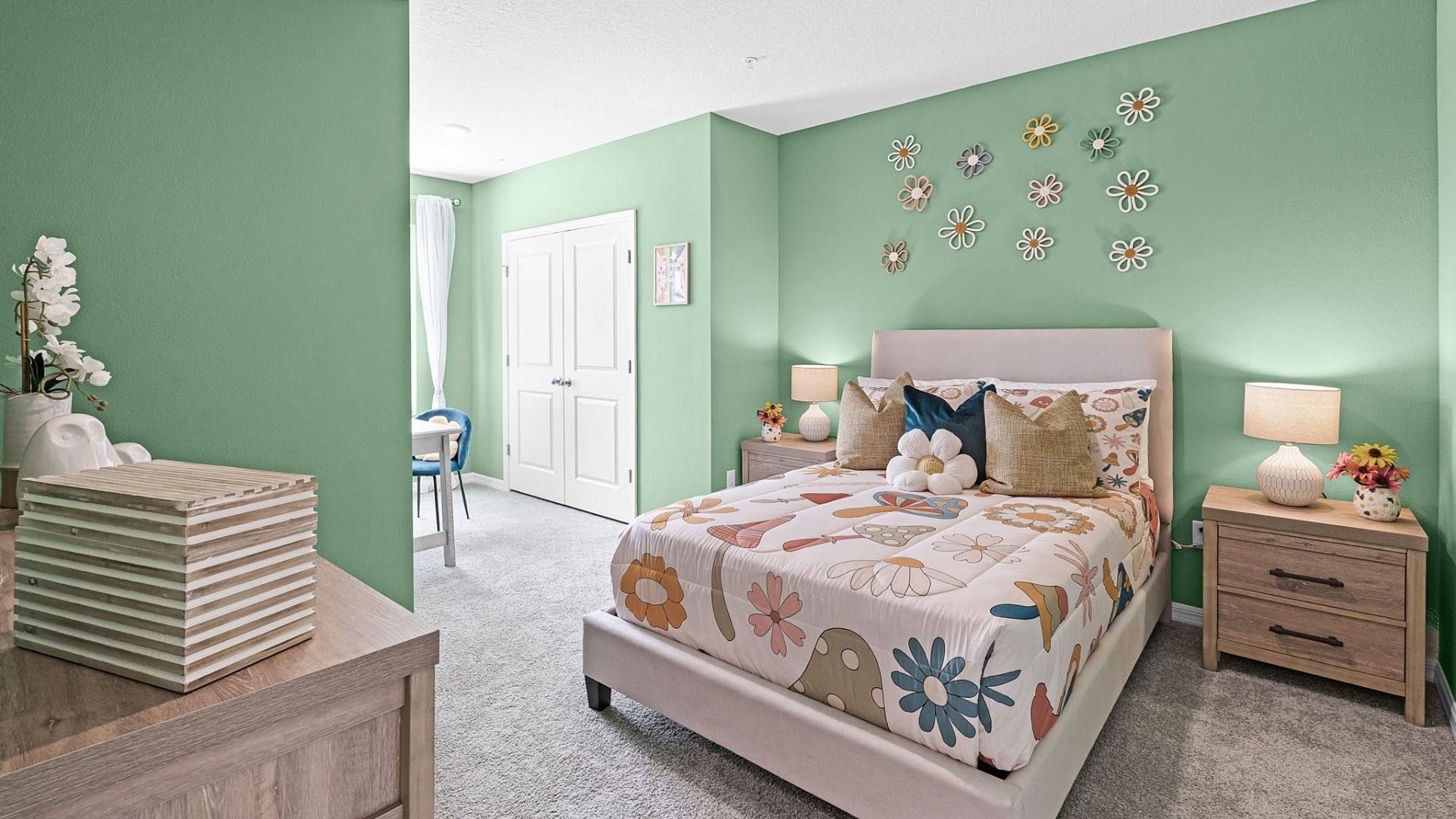 Guest bedroom with bed, nighstands and natural lighting.