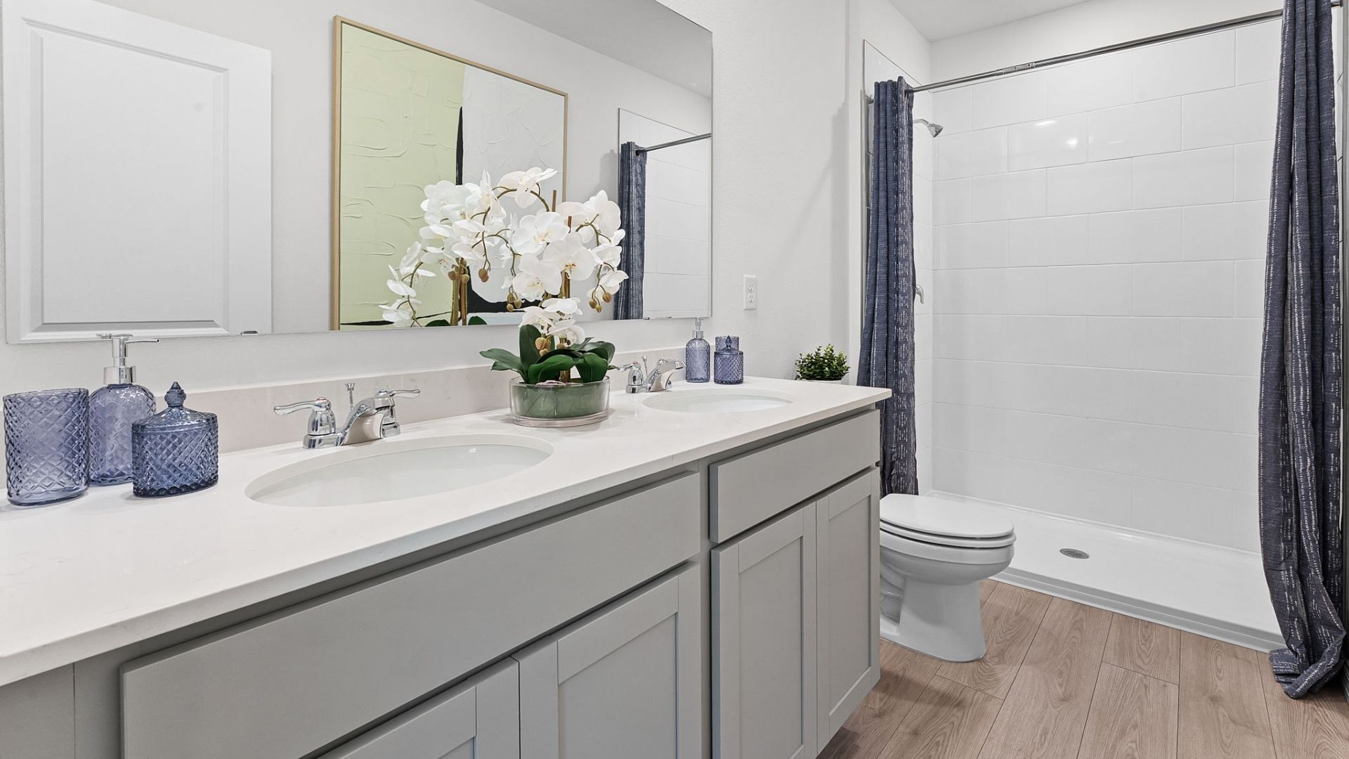 primary bathroom quartz counters and laminate flooring