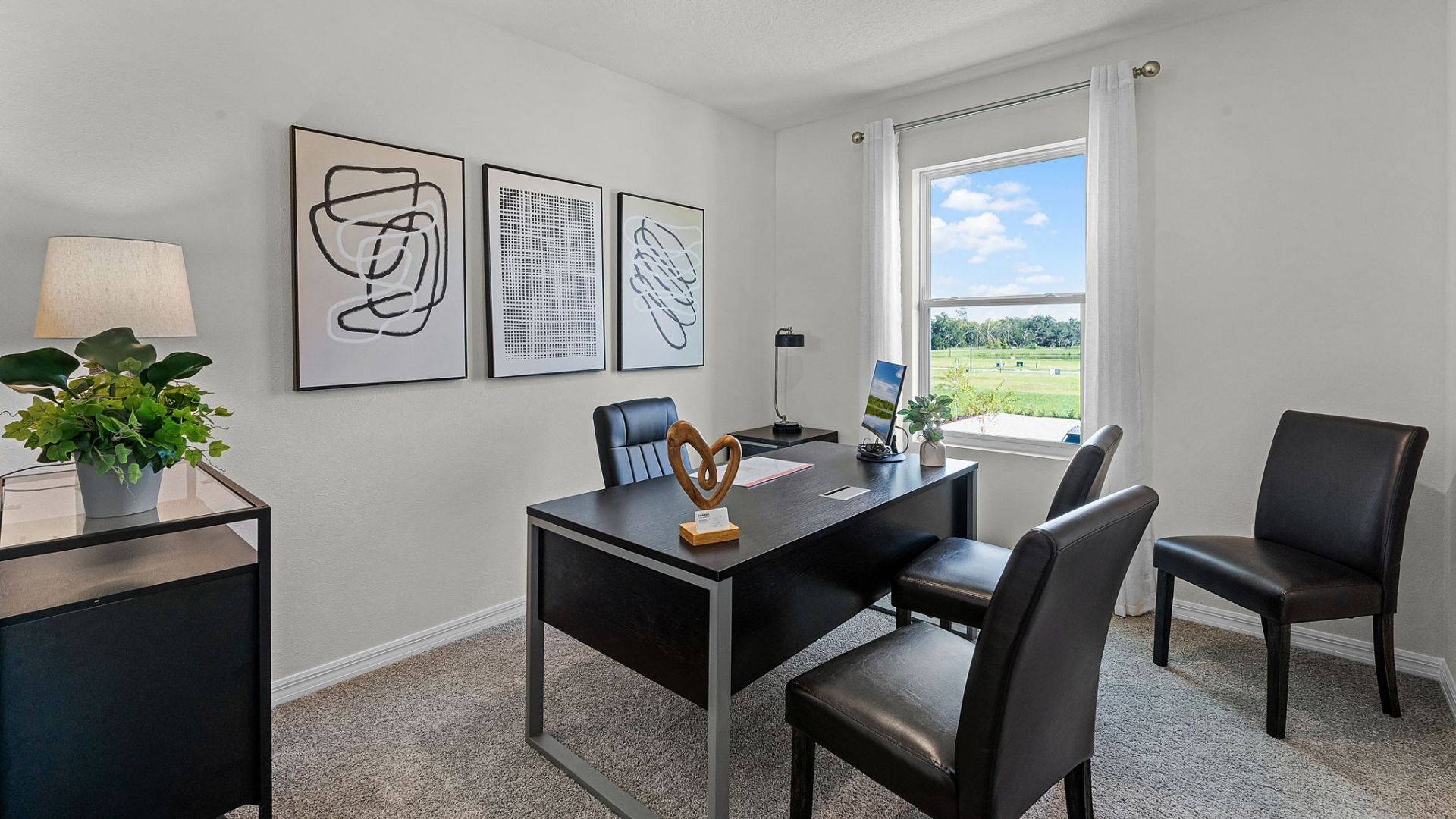 Functional home office with desk, chairs and space to work or play.