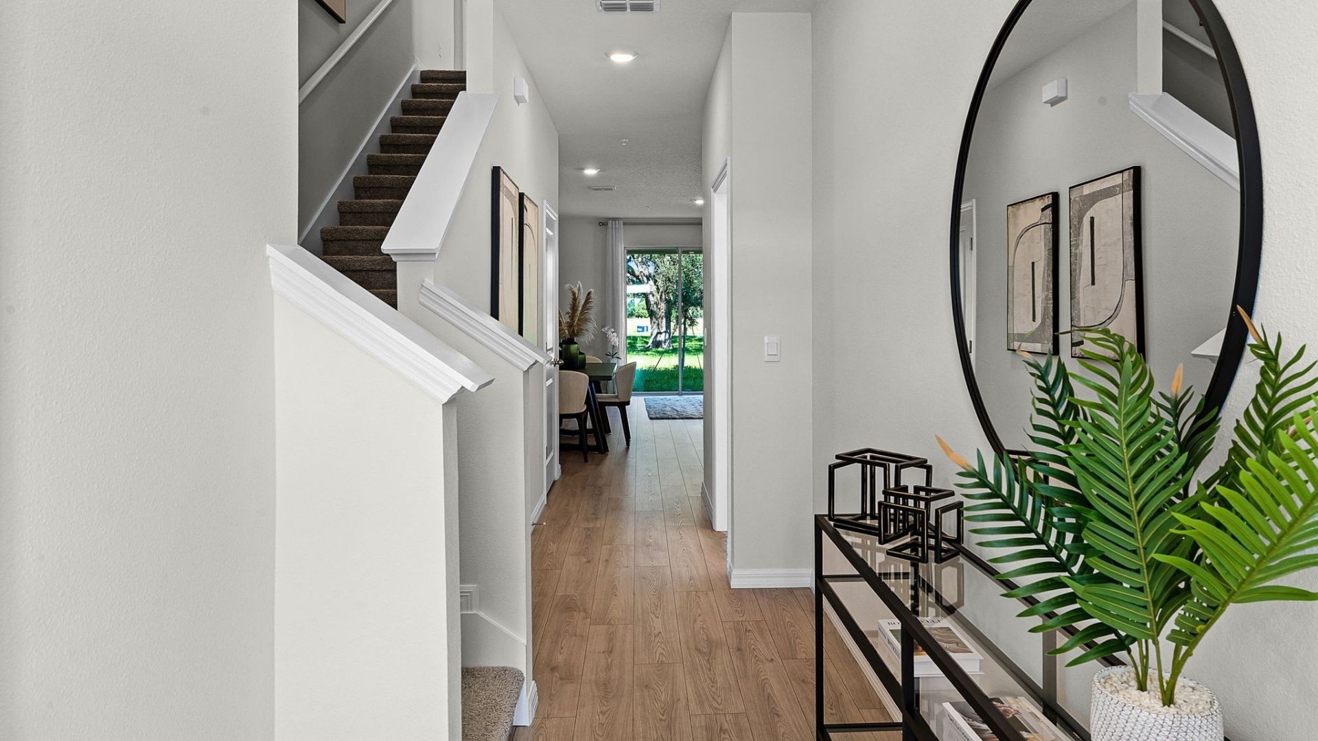entry way to home with laminate flooring
