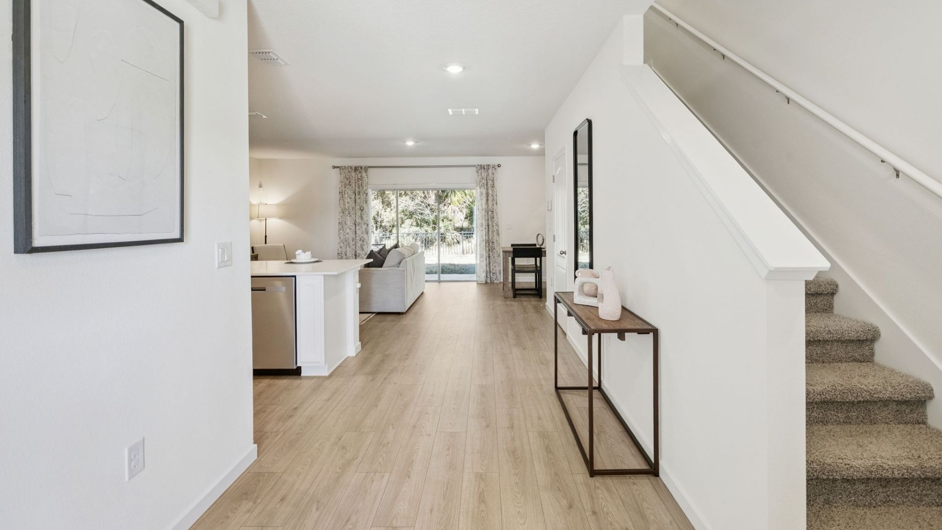entry way to home with laminate flooring