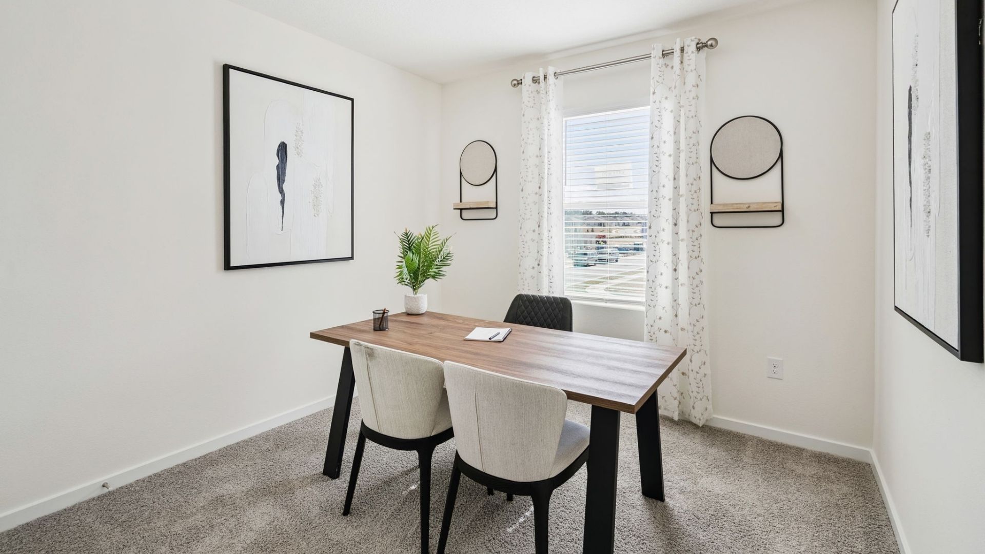 Functional home office with desk, chairs and space to work or play.