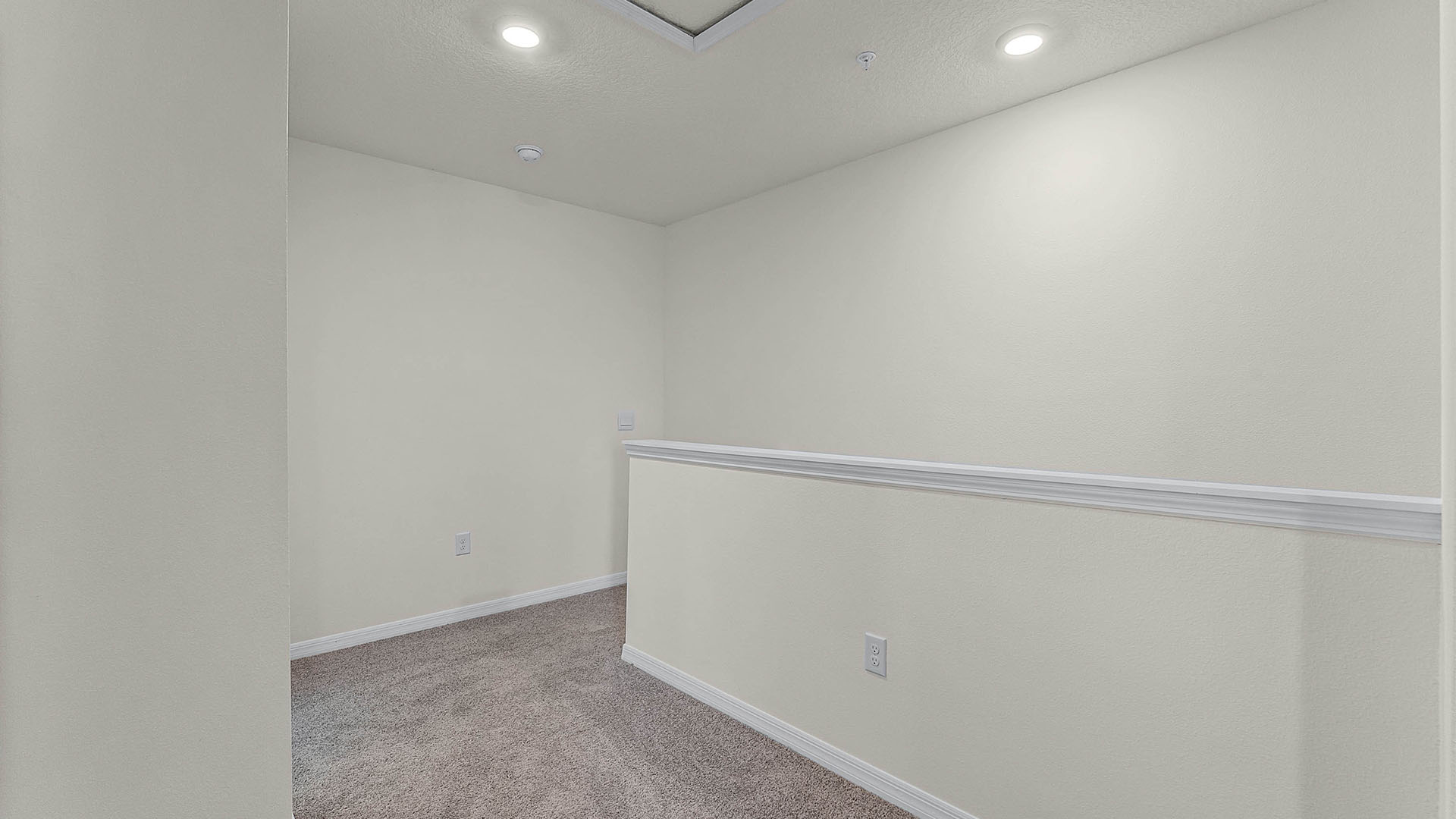 Second story hallway leading to primary bedroom, guest bathroom and two guest bedrooms.