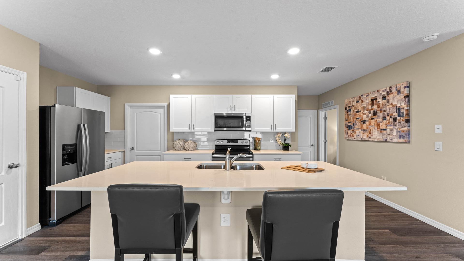 kitchen quartz counters and luxury vinyl plank flooring