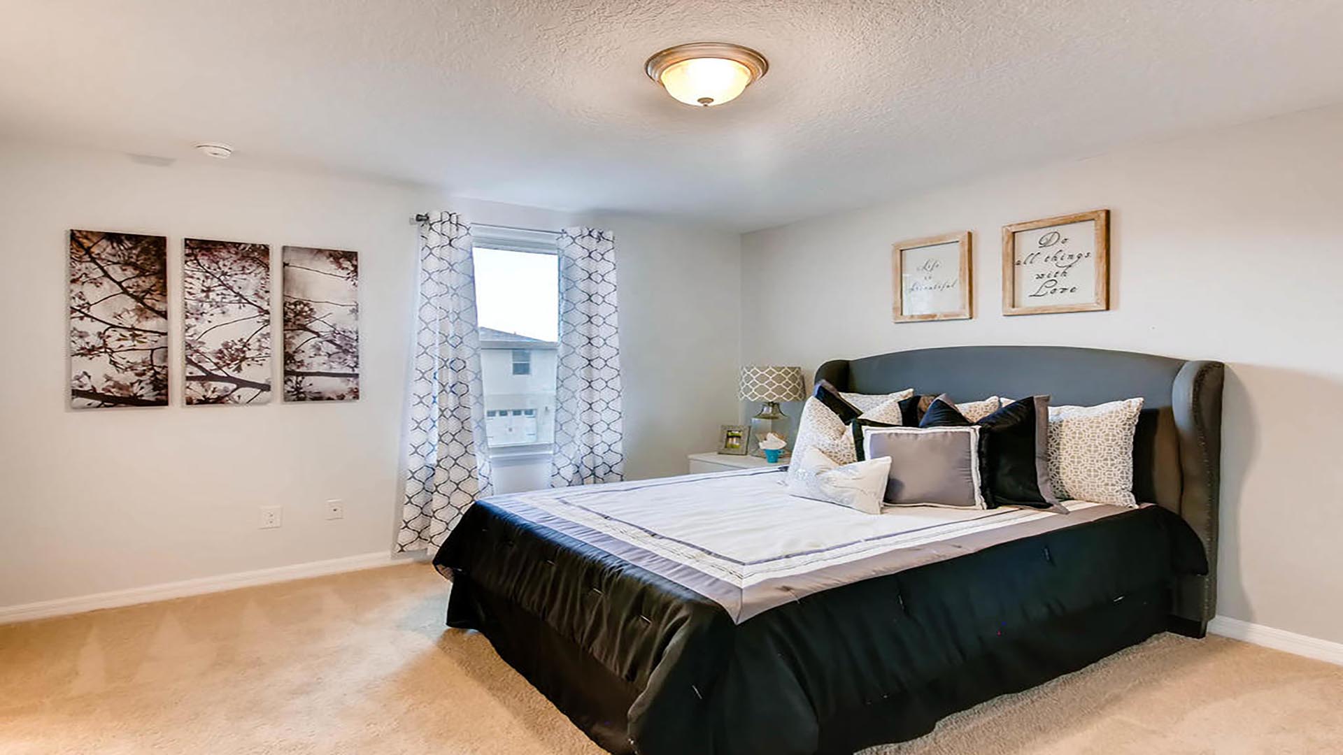 primary bedroom with king sized bed