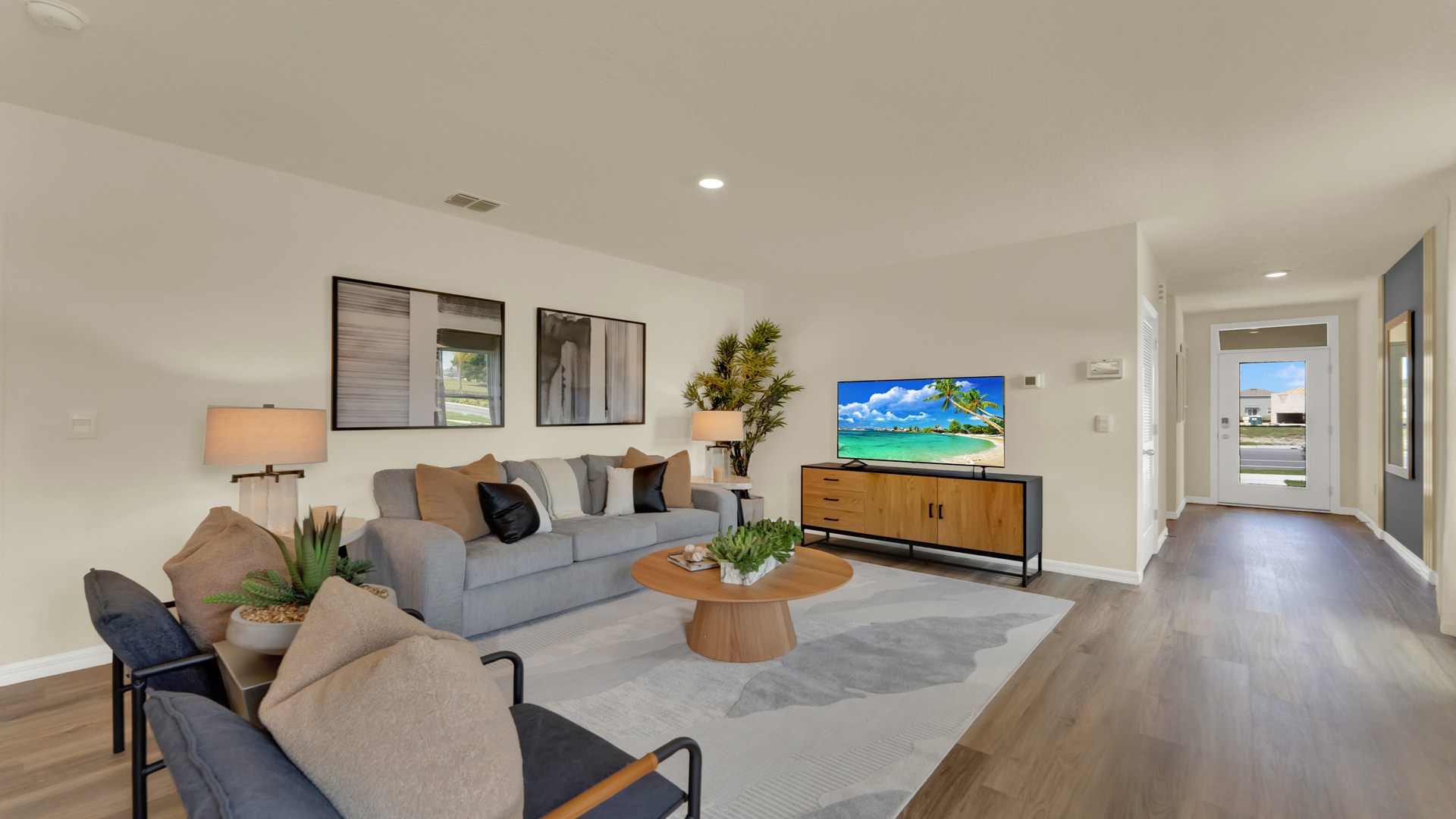Dining room adjacent to the kitchen with table, chairs and tile flooring.