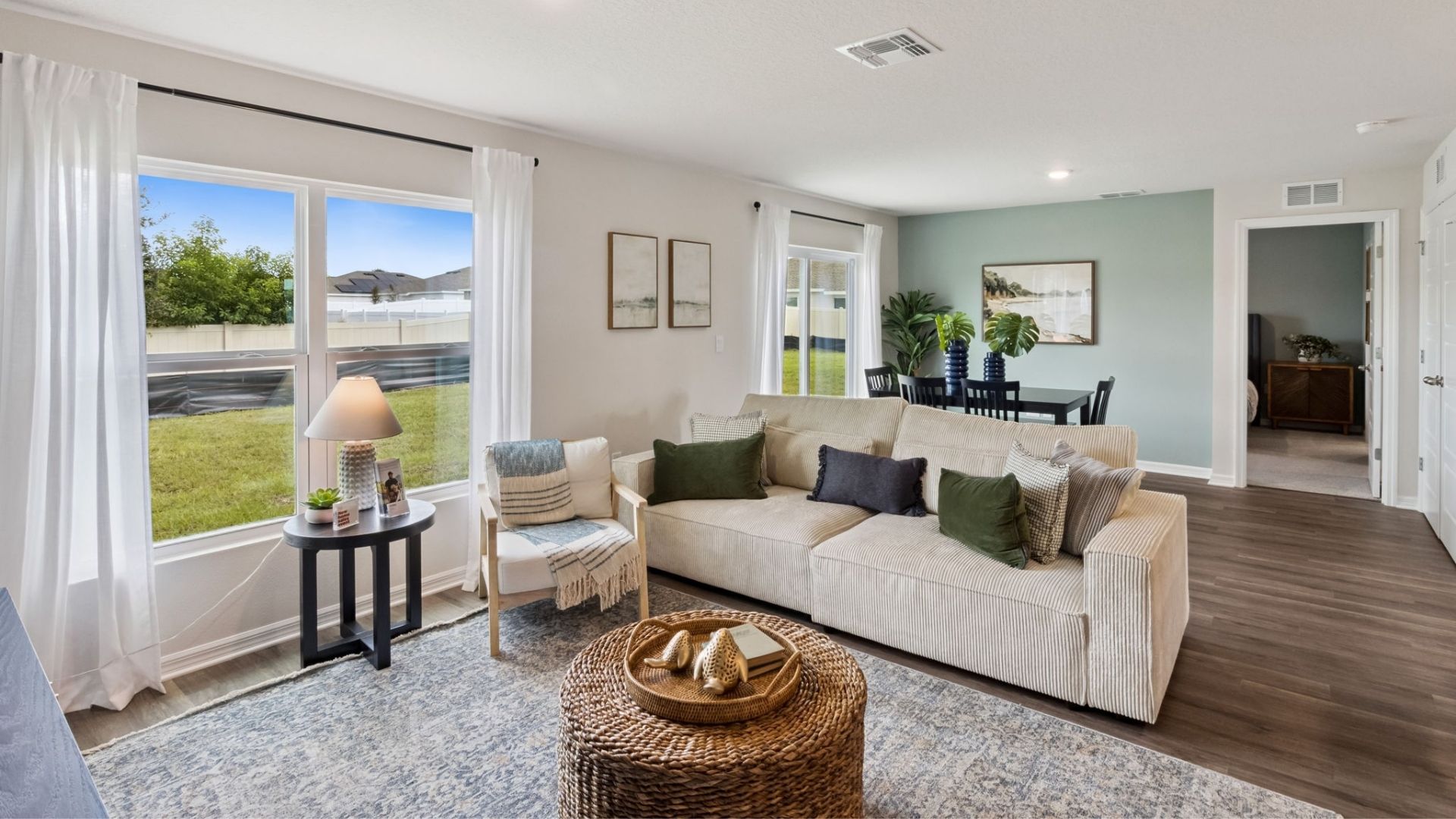 living area with couch seating anddining room