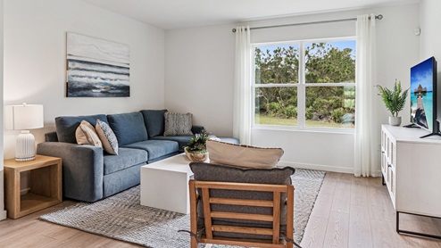 living area with laminate flooring
