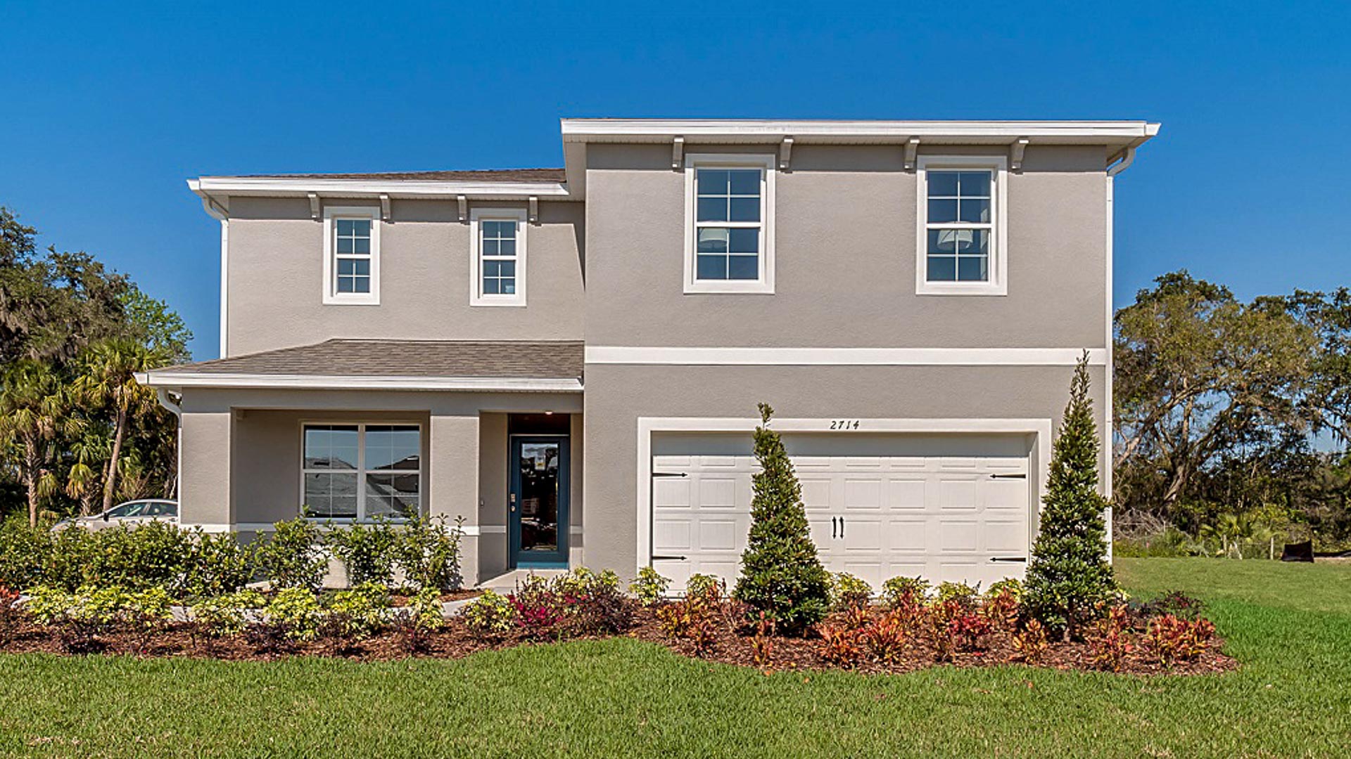 Two-story home with two car garage.