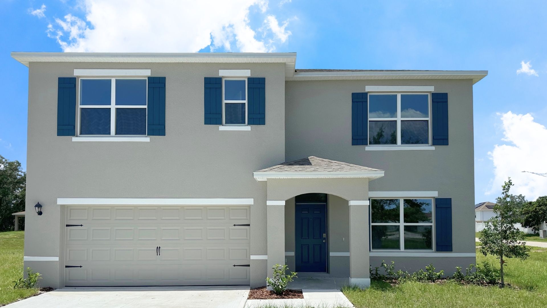 Two-story home with two car garage.