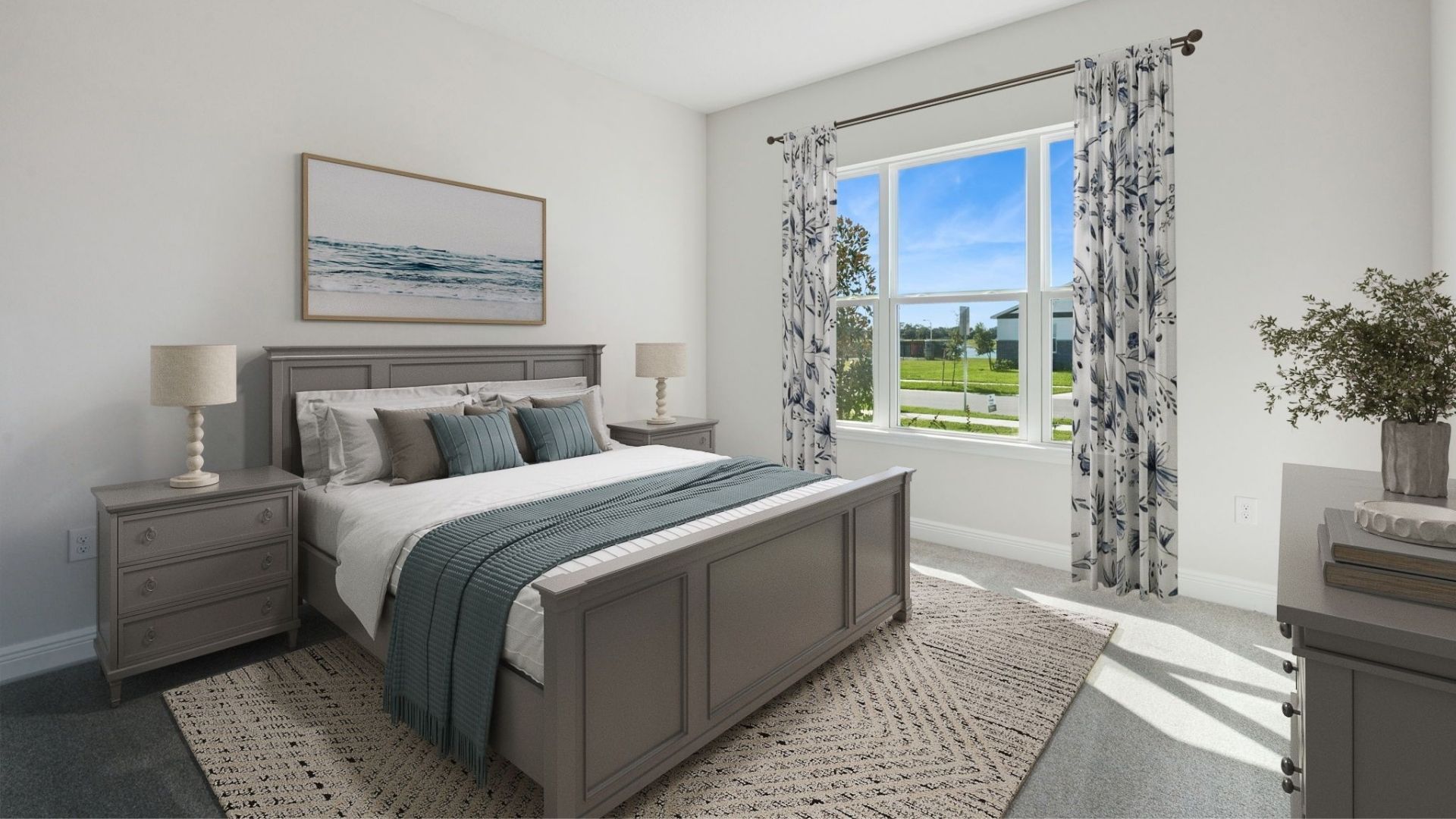 Guest bedroom with bed, nighstands and natural lighting.