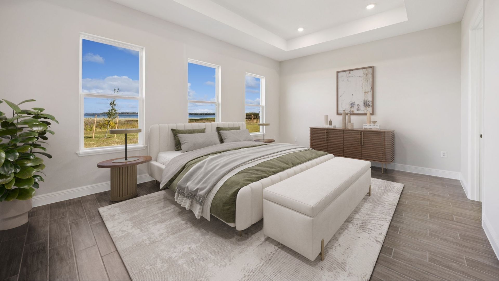 primary bedroom with lake view and king sized bed