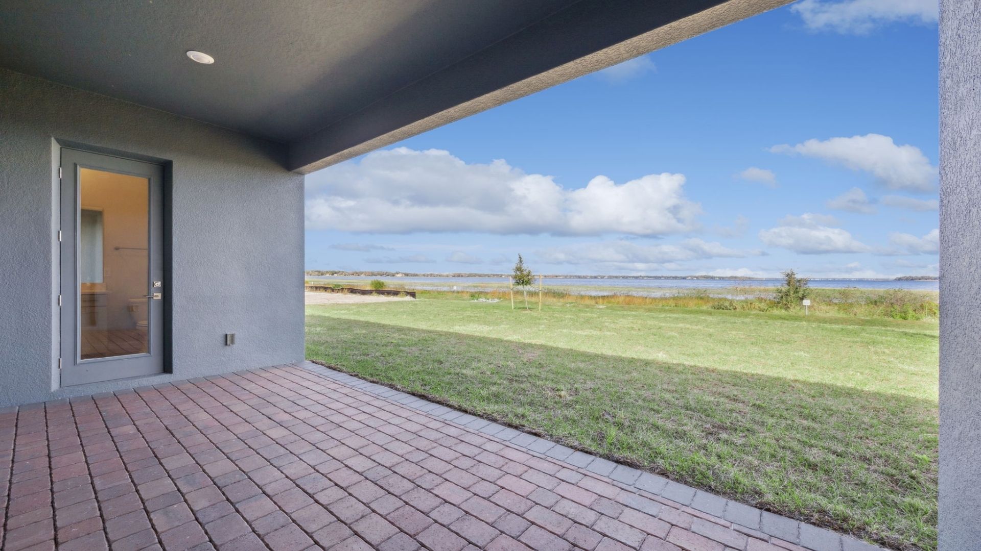 rear of home with lake view