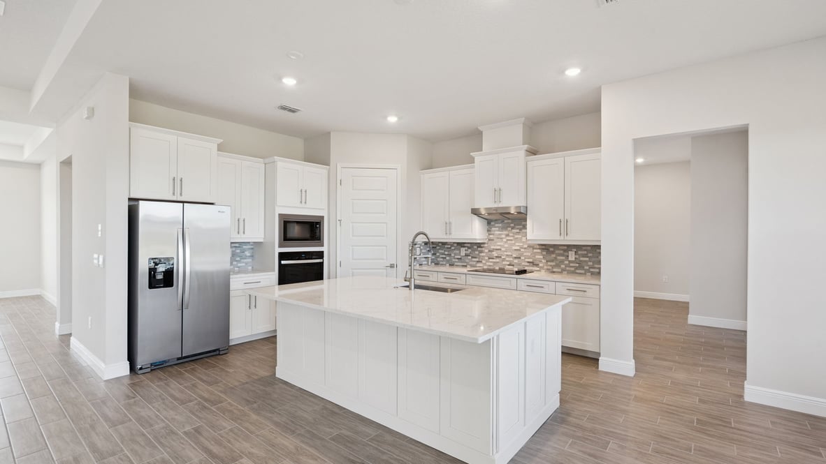 Kitchen with quartz counters and laminate flooring