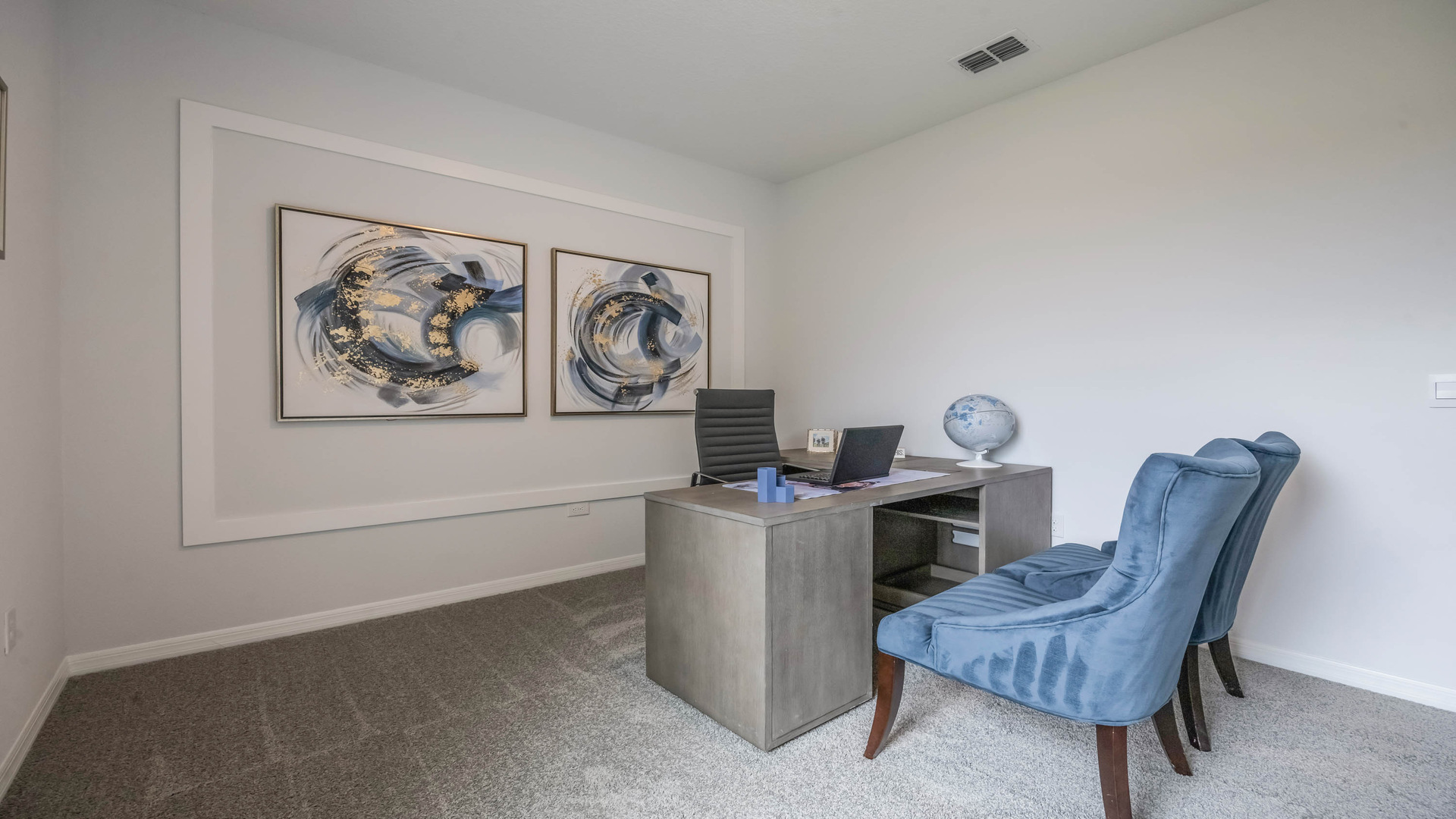 Functional home office with desk, chairs and space to work or play.