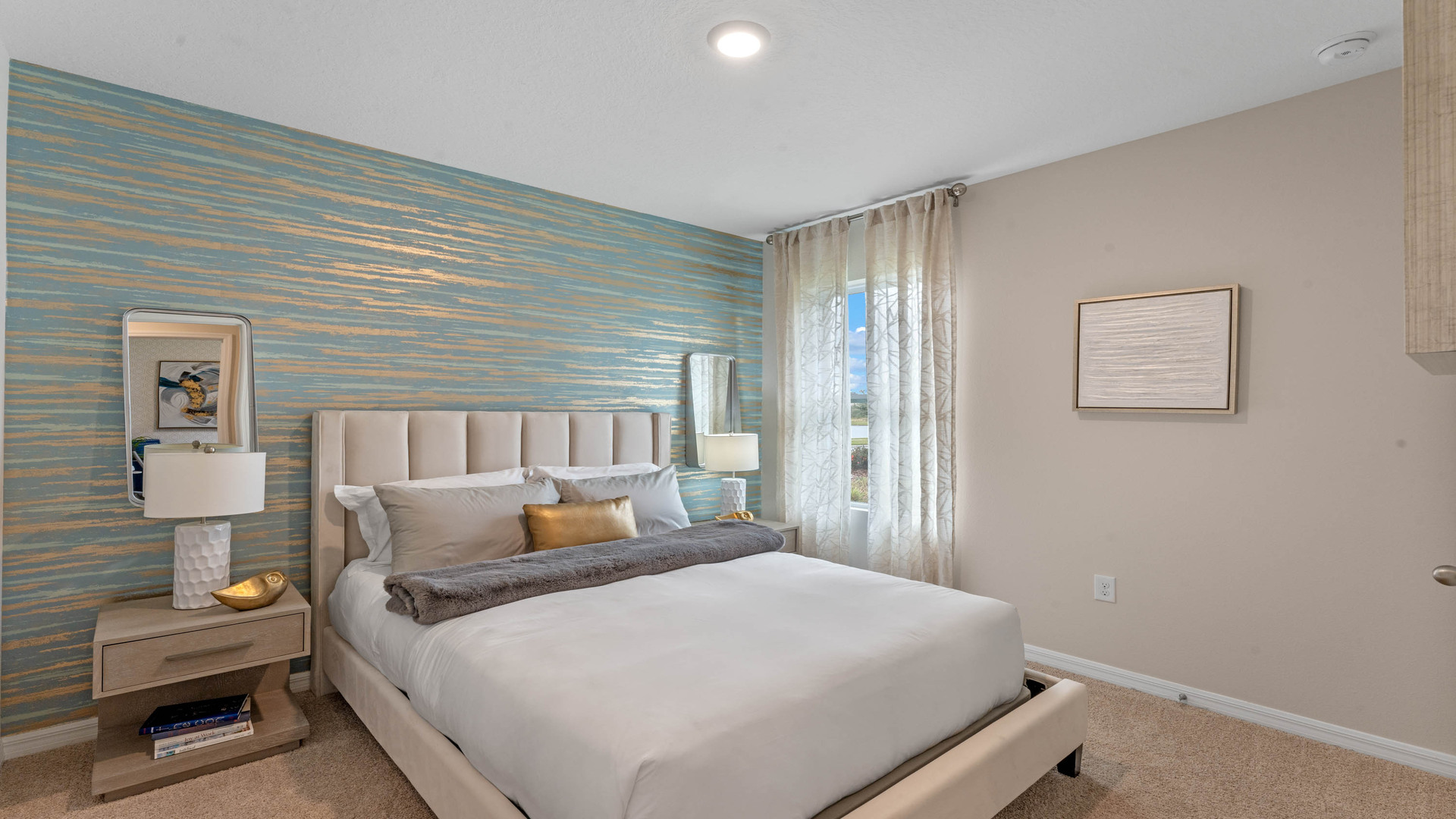 Guest bedroom with bed, nighstands and natural lighting.