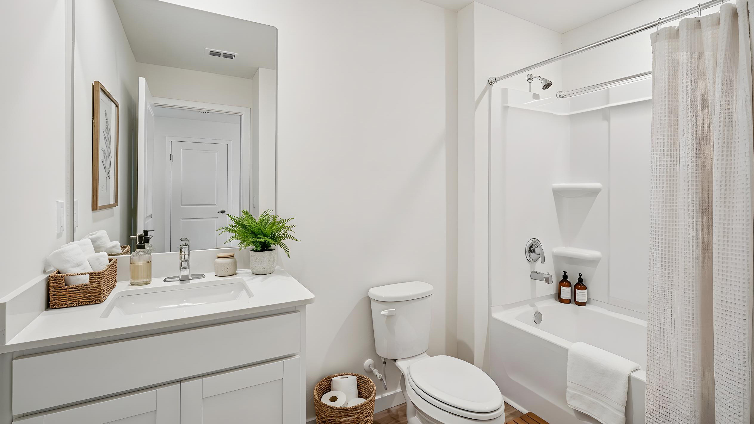 Guest bathroom with single vanity quartz countertops, toilet and shower.