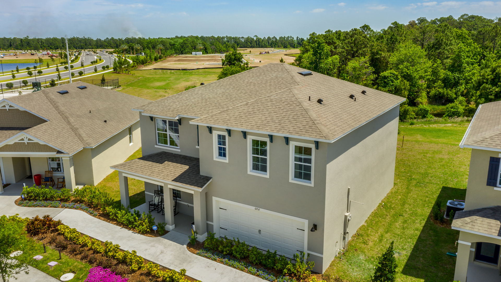 Two-story home with two car garage.