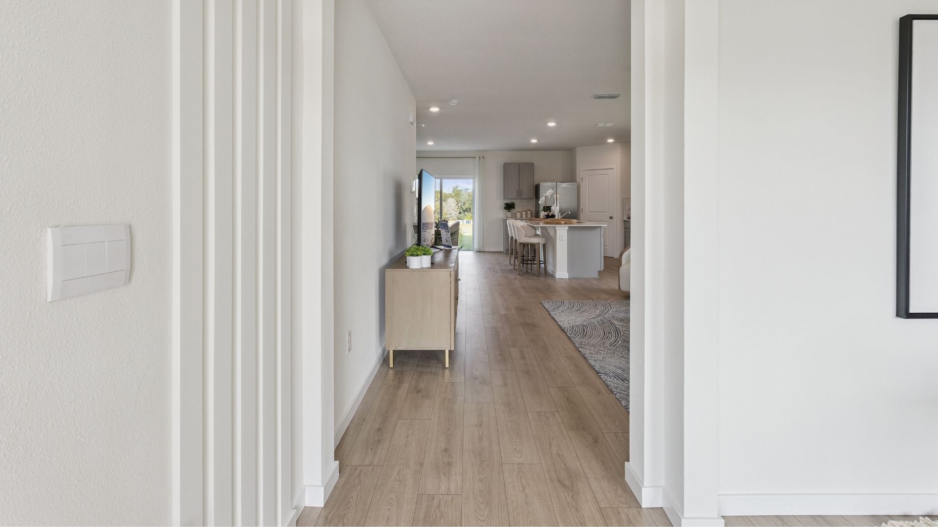 entry home with laminate flooring