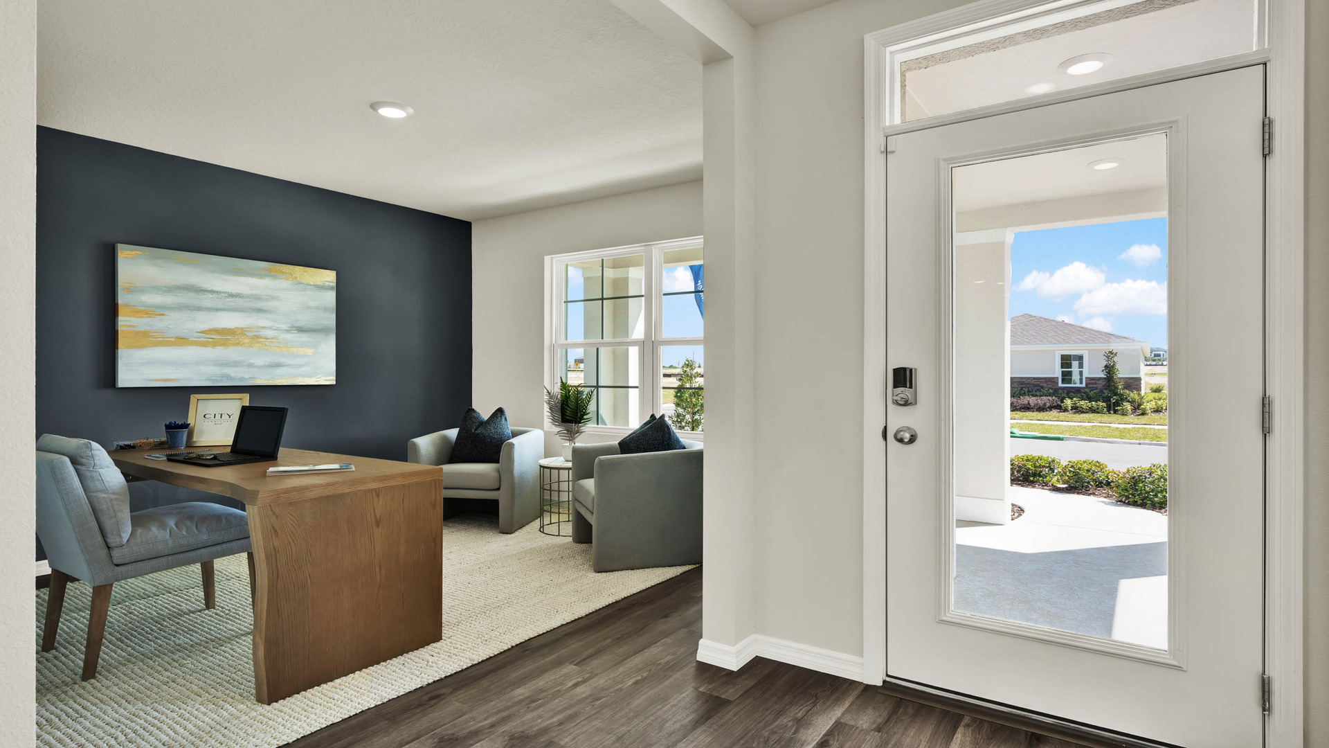 Entry to home with study room and luxury vinyl plank flooring.
