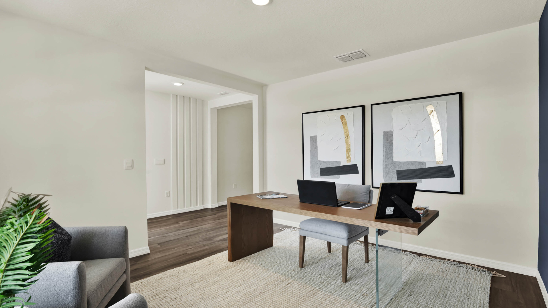 Functional home office with desk, chairs and space to work or play.