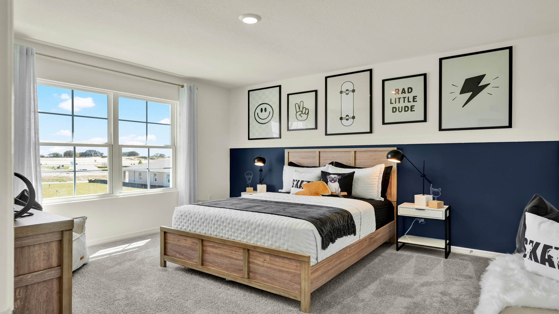 Guest bedroom with bed, nighstands and natural lighting.