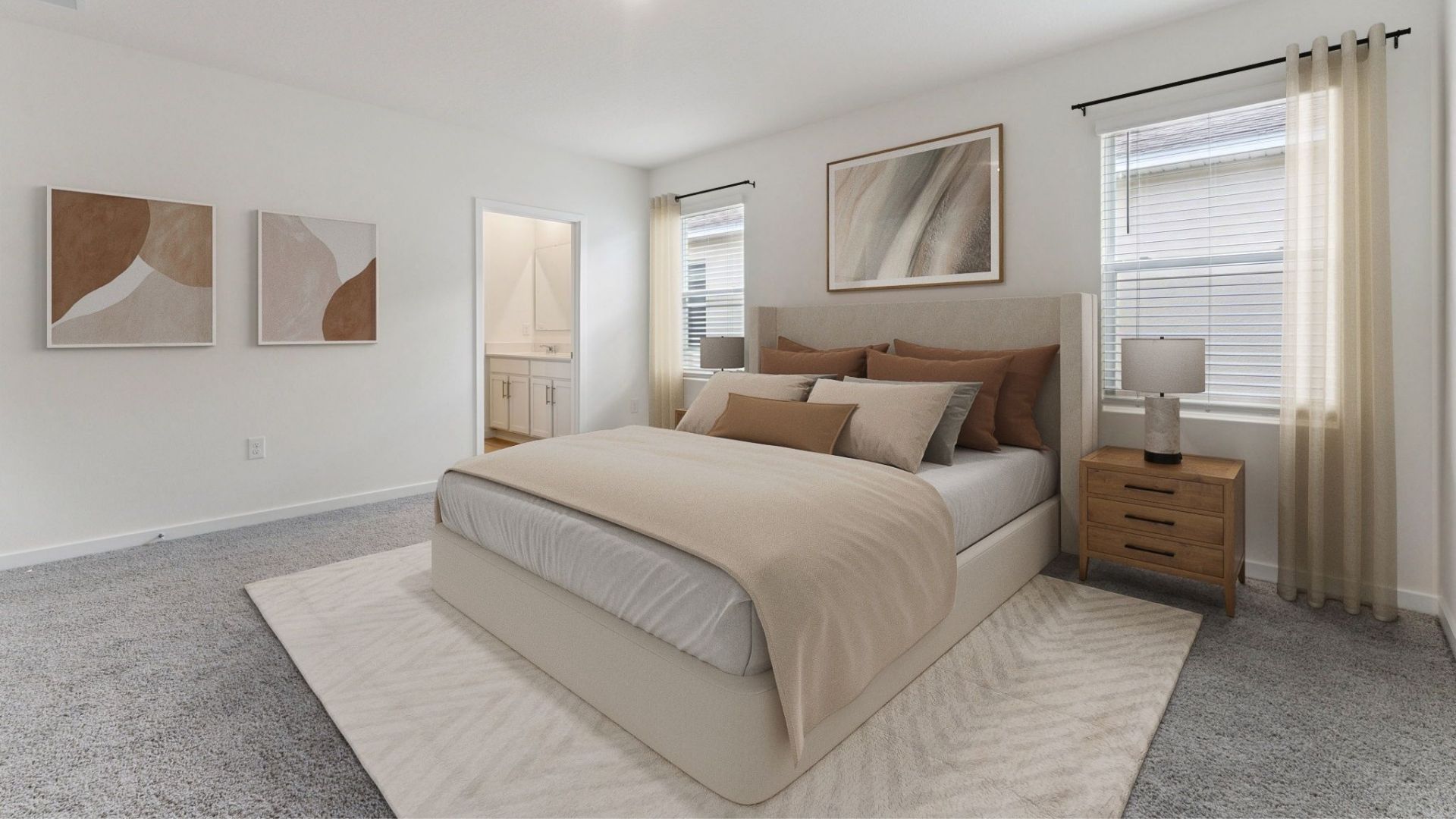 Spacious primary bedroom with king size bed, carpet flooring, natural lighting showing access to primary bathroom.