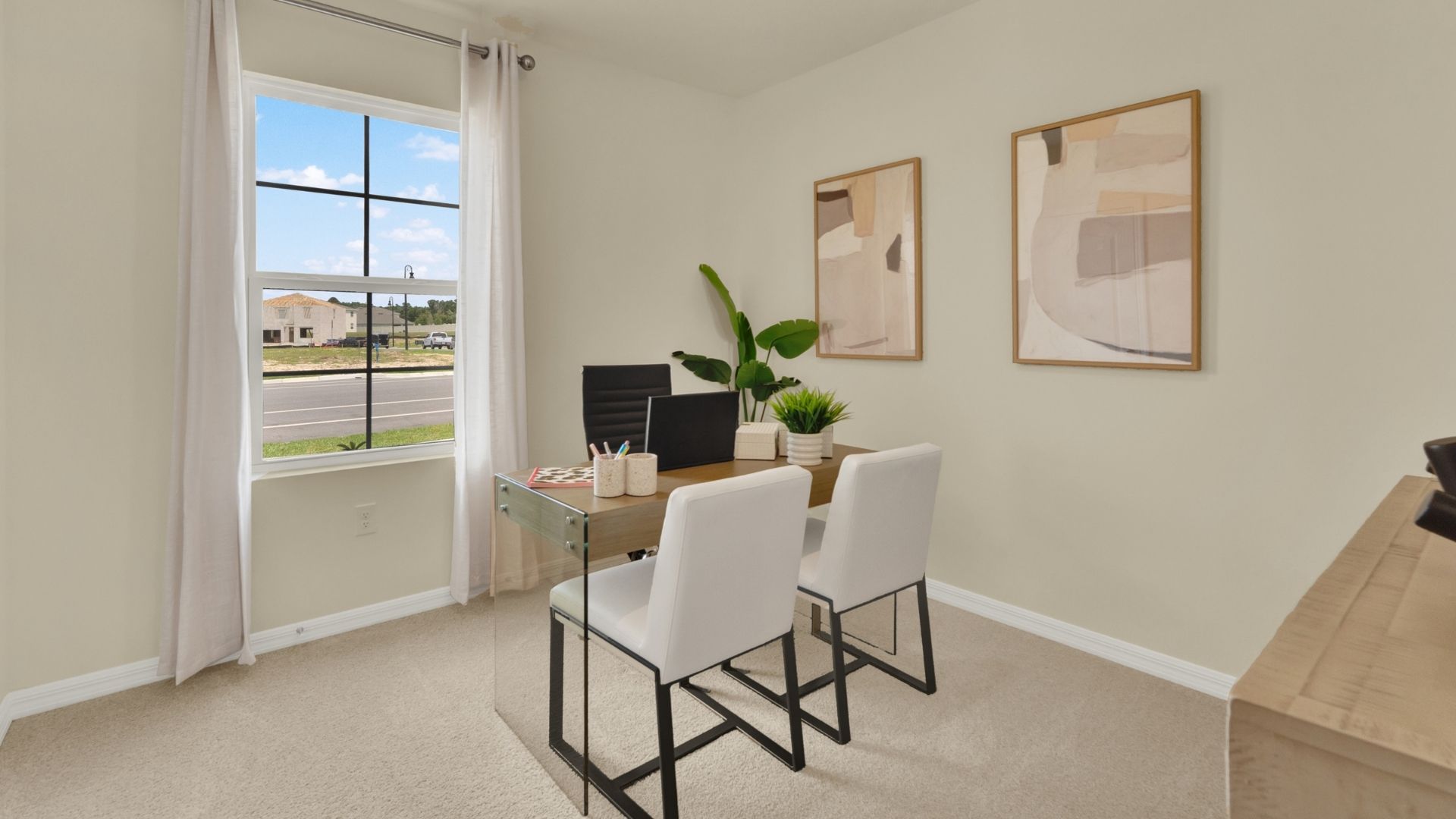 Functional home office with desk, chairs and space to work or play.