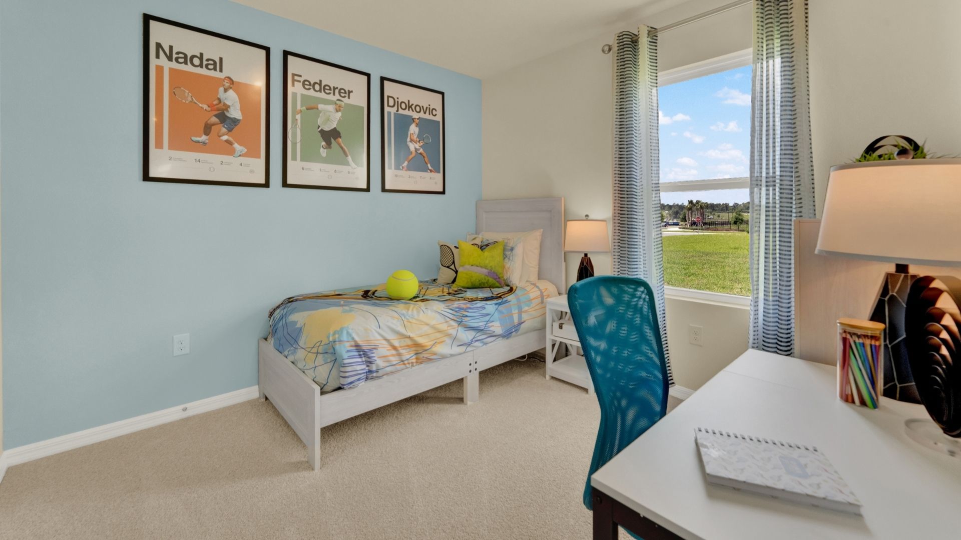 Guest bedroom with bed, nighstand and natural lighting and spacious closet.