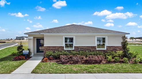Single story new home with large windows.