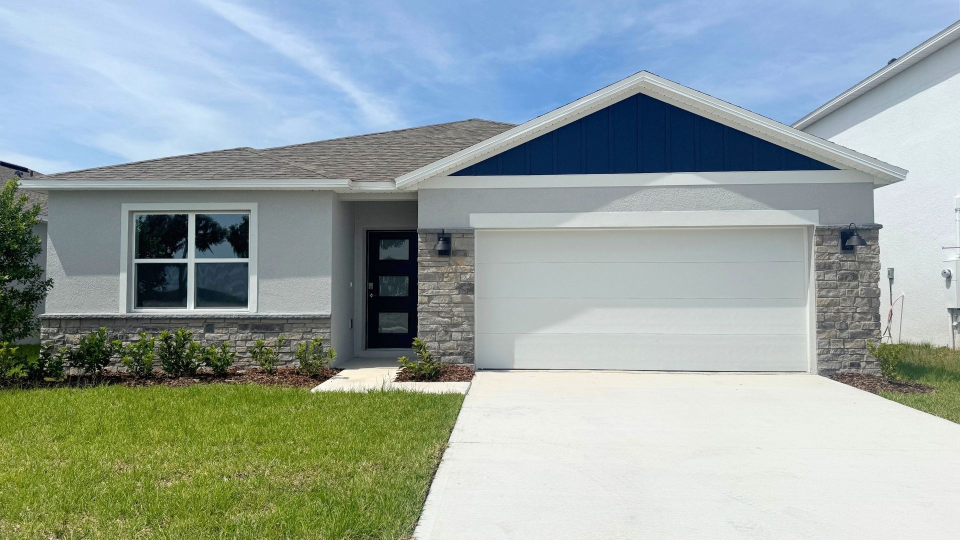 single story home with two car garage