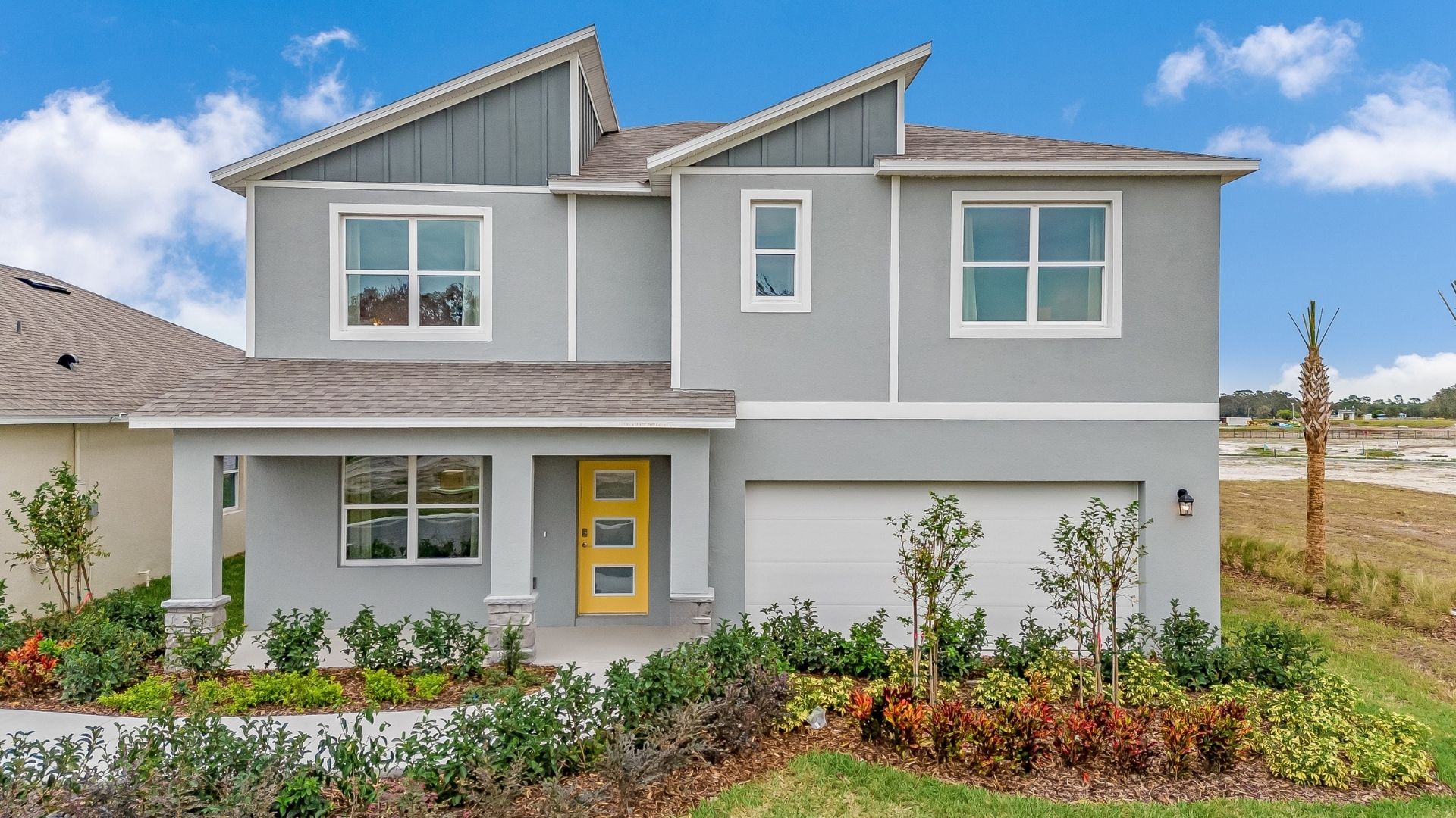 Two-story home with two car garage.